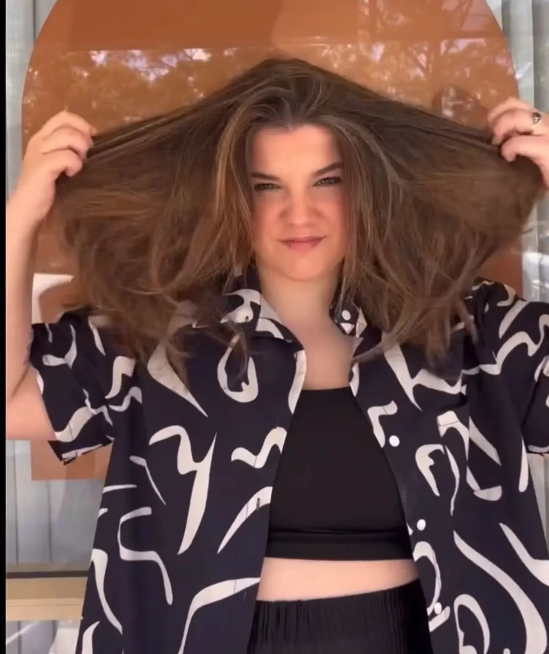 Hair before Qiqi treatment, showing frizz and texture